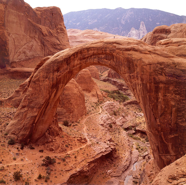 Rainbow Bridge with man on top, by Stan Jones